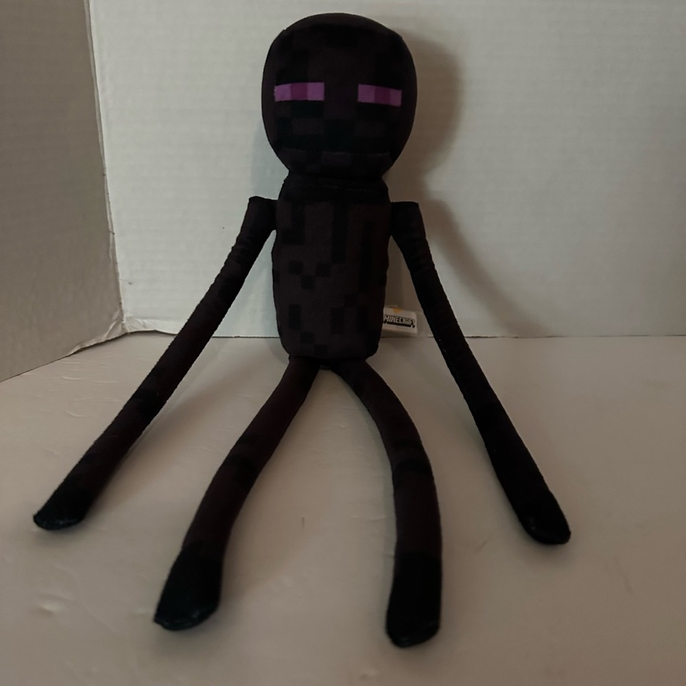 Black Plush Toy with Purple Eyes